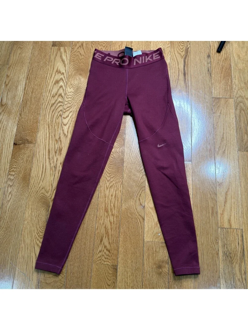 Size Small Women’s Nike Pro Dri-FIT  Burgundy Color.